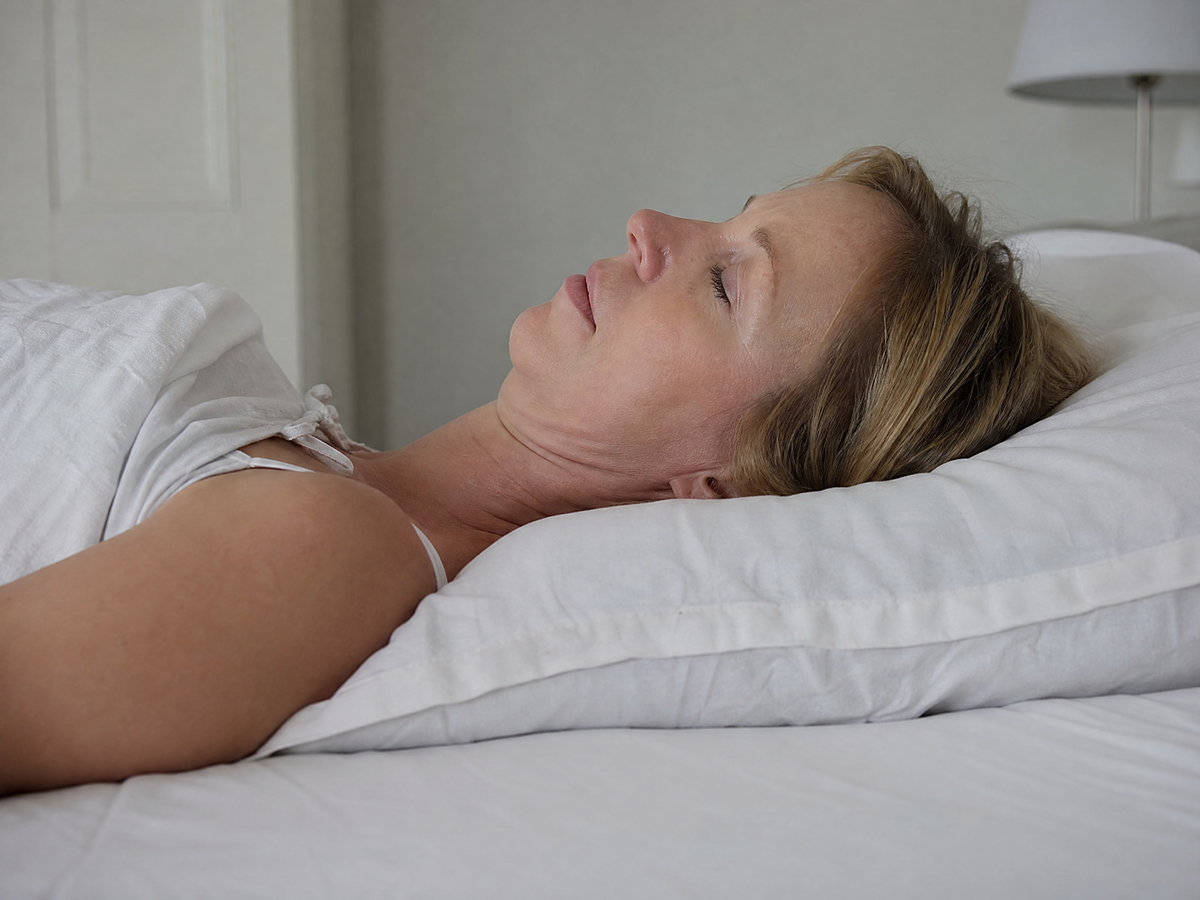 A flat pillow lets your head tip back and your neck bend.